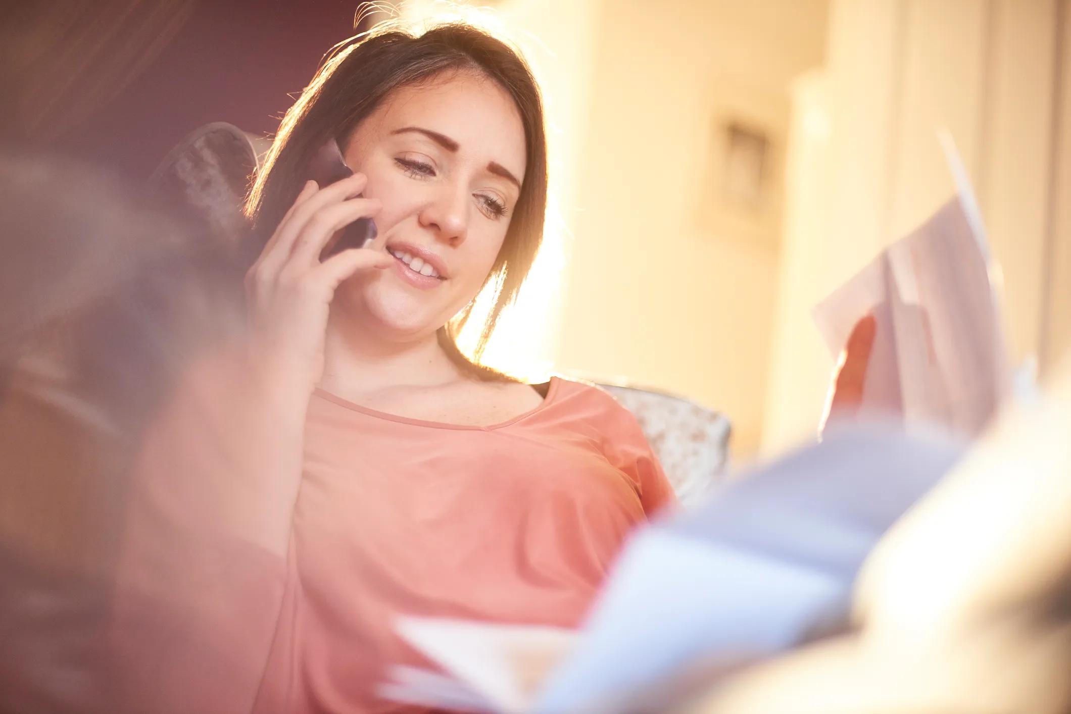 photo showing a woman contacting her utility distributor to find her energy supplier